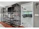Open concept living area with modern shelving and bright natural light at 819 E Harbour Ct, Ocoee, FL 34761