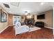 Inviting living room features a brick fireplace, wood floors, and neutral color scheme at 819 E Harbour Ct, Ocoee, FL 34761