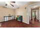 Home office with hardwood floors, access to other rooms, and built in drawers and shelves at 819 E Harbour Ct, Ocoee, FL 34761