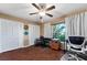 Home office with hardwood floors, two closets, a ceiling fan and multiple work spaces at 819 E Harbour Ct, Ocoee, FL 34761