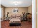 Relaxing sitting room with wood floors, plush seating, and decorative lamps at 819 E Harbour Ct, Ocoee, FL 34761