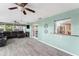 Bright sunroom with large windows, tile floors, and access to other living spaces at 819 E Harbour Ct, Ocoee, FL 34761
