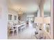 Open-concept dining area with modern furnishings, tile flooring, and stylish decor at 8383 Madrid St, Lakeland, FL 33810