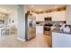 Modern kitchen with stainless steel appliances, granite countertops, and white cabinetry at 8383 Madrid St, Lakeland, FL 33810
