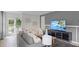 Bright and airy living room featuring modern decor, comfortable seating, and a view to the outdoors at 8391 Madrid St, Lakeland, FL 33810