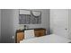 Modern office space with desk, chair, storage, and minimalist artwork at 8391 Madrid St, Lakeland, FL 33810