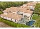 Aerial view showcasing the home's large size, pool, backyard, and landscaping at 9032 Tavolini Ter, Windermere, FL 34786