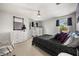 Bright bedroom with a comfortable bed, elegant decor, and ample natural light from the windows at 9032 Tavolini Ter, Windermere, FL 34786