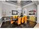 Elegant dining room with modern chandelier, comfortable seating, and stylish decor at 9032 Tavolini Ter, Windermere, FL 34786