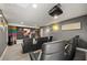 Private home theater with comfortable seating, a large screen, and premium audio equipment at 9032 Tavolini Ter, Windermere, FL 34786