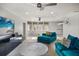 Open-concept living area with a comfortable seating arrangement, media center, and scenic window views at 9032 Tavolini Ter, Windermere, FL 34786