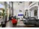 Spacious living room with high ceilings, modern furnishings, and large windows for ample natural light at 9032 Tavolini Ter, Windermere, FL 34786
