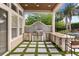 Elegant outdoor kitchen with a built-in grill and stainless steel appliances overlooking the beautiful pool area at 9032 Tavolini Ter, Windermere, FL 34786