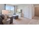 Relaxing living room with a sofa, ottoman, and entertainment center with a TV at 947 Princess Sabal Pt, Haines City, FL 33844