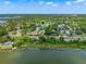 Scenic aerial view of a lakeside community with lush greenery; location marked with a pin at 996 Fairview Ave, Mount Dora, FL 32757