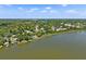 Expansive aerial view of a scenic lakeside community with lush greenery at 996 Fairview Ave, Mount Dora, FL 32757