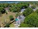 Beautiful aerial view of a home surrounded by lush trees, highlighting its serene, natural setting at 996 Fairview Ave, Mount Dora, FL 32757