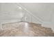Finished attic space featuring a small window, and tile flooring at 996 Fairview Ave, Mount Dora, FL 32757