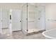 Bathroom featuring a glass-enclosed shower and white subway tiles at 996 Fairview Ave, Mount Dora, FL 32757