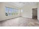 Bedroom featuring large windows with waterfront views and ceramic tile floors at 996 Fairview Ave, Mount Dora, FL 32757