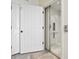 Convenient residential elevator with an open door next to a set of white interior doors at 996 Fairview Ave, Mount Dora, FL 32757