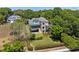 Beautiful multi-story home with stone accents, a well-manicured lawn, and mature trees at 996 Fairview Ave, Mount Dora, FL 32757