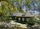Beautiful exterior view of the home surrounded by lush greenery and mature trees at 996 Fairview Ave, Mount Dora, FL 32757
