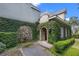 Beautiful home with ivy-covered accents, stone features, and meticulously maintained landscaping at 996 Fairview Ave, Mount Dora, FL 32757