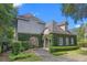 Stunning home with ivy-covered walls, stone accents, and meticulously manicured landscaping at 996 Fairview Ave, Mount Dora, FL 32757