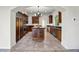 Spacious kitchen features custom wood cabinetry, granite countertops, stainless steel appliances and large island at 996 Fairview Ave, Mount Dora, FL 32757