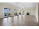 A spacious living room with access to a balcony, and a fireplace at 996 Fairview Ave, Mount Dora, FL 32757