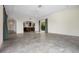 Open-concept living area with tile flooring, archways, large windows, and elegant details, ideal for modern living at 996 Fairview Ave, Mount Dora, FL 32757