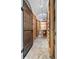 Custom wine cellar with a secure metal gate and wooden racks for storing wine bottles at 996 Fairview Ave, Mount Dora, FL 32757