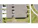 Aerial view of the house with roof, backyard, and two cars parked in the driveway at 10940 Leafshore Loop, Orlando, FL 32829