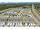 Aerial view showcasing a neighborhood with well-maintained townhomes and convenient street access at 10940 Leafshore Loop, Orlando, FL 32829