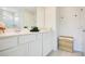 Bright bathroom with double sink vanity, quartz countertops, and modern fixtures at 10940 Leafshore Loop, Orlando, FL 32829