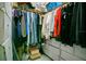 Organized walk-in closet with clothing racks, drawers, and ample storage space at 10940 Leafshore Loop, Orlando, FL 32829