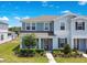 Charming two-story townhome with a well-maintained lawn and a welcoming front entrance at 10940 Leafshore Loop, Orlando, FL 32829