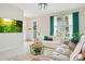 Bright living room featuring tile flooring, modern furniture, and an open layout with natural light at 10940 Leafshore Loop, Orlando, FL 32829