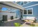 Outdoor patio area with seating, a grill, and a well-maintained paver surface for relaxation at 10940 Leafshore Loop, Orlando, FL 32829