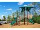 Community playground with slides, climbing structures, and a protective canopy at 10940 Leafshore Loop, Orlando, FL 32829