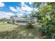 View of the screen enclosed in ground pool in the private backyard at 1130 Woodchuck Ct, Orange City, FL 32763