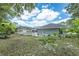 View of the backyard showing fence and ample yard space at 1130 Woodchuck Ct, Orange City, FL 32763