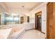 Bathroom featuring a large tub, shower, and ample counter space with storage cabinets at 1130 Woodchuck Ct, Orange City, FL 32763