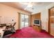 Versatile bonus room features carpeted floor, sliding door to pool, and closet at 1130 Woodchuck Ct, Orange City, FL 32763