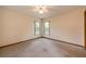 Bright bedroom featuring neutral walls, carpet flooring, and double windows for natural light at 1130 Woodchuck Ct, Orange City, FL 32763