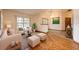 Bright living room with neutral furniture, a large window and views of the outdoors at 1130 Woodchuck Ct, Orange City, FL 32763