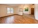 Living room with hardwood floors and a view of the front yard at 1130 Woodchuck Ct, Orange City, FL 32763