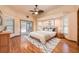 Bright and spacious main bedroom with natural light and a sliding door to pool at 1130 Woodchuck Ct, Orange City, FL 32763