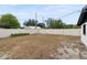 Expansive backyard with a white fence and lush greenery for outdoor enjoyment and privacy at 114 Spring Lake Cir, Ocoee, FL 34761